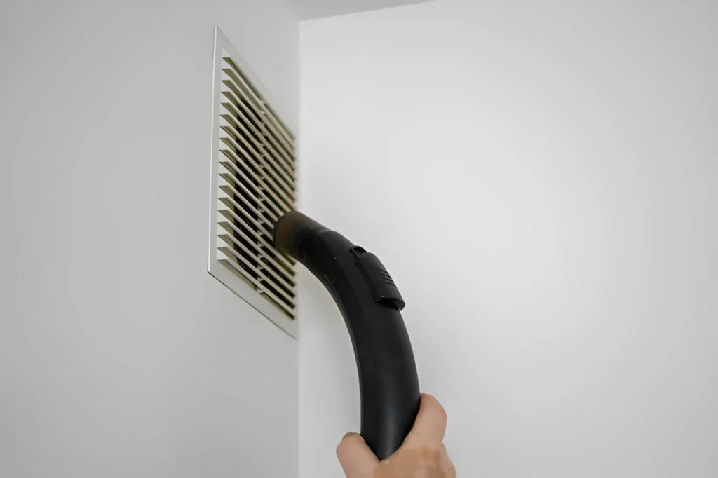 Professional Vent Cleaning Near Me service cleaning vents inside a commercial building.